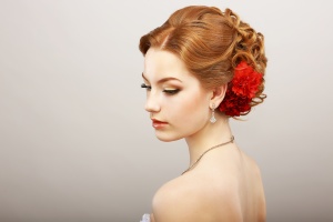 Bride. Golden Hair Female with Red Flower. Platinum Necklace